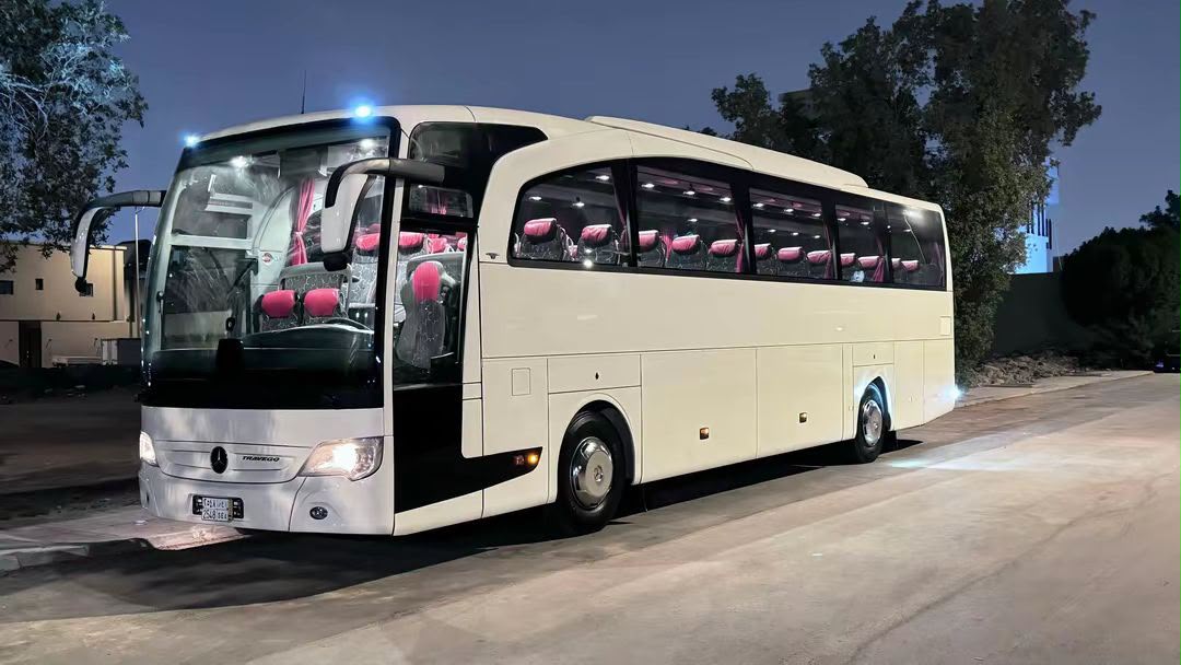 Travego coach at night